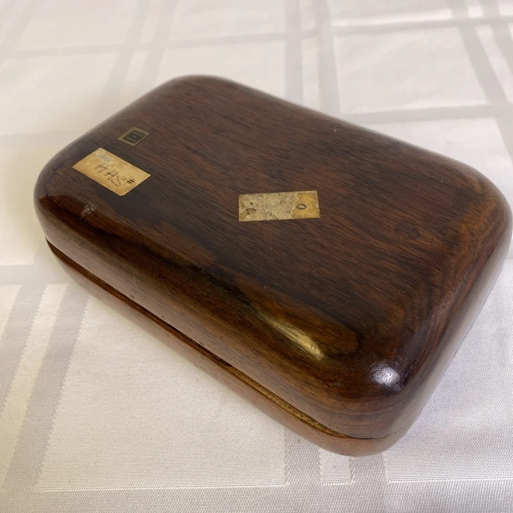 Hand carved 2 piece wood box with metal hinge, hook and metal ribs on lid